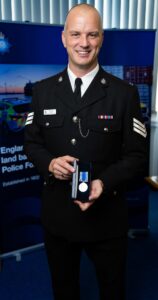 3.Sergeant Nigel Morgan with his Long Service and Good Conduct medal marking his 20 year career with the police